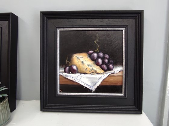 Cheese and grapes still life