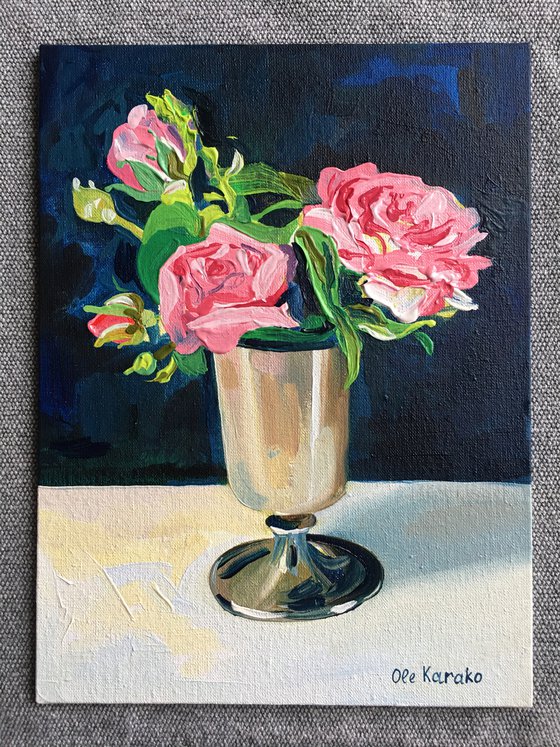 Miniature pink roses in a silver vase