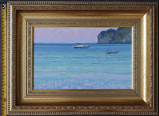 Sunset. Boats on the sea