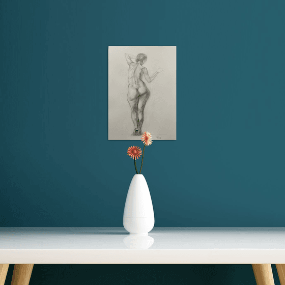 Nude woman figure from behind standing