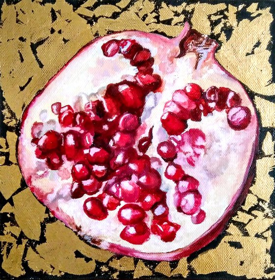 Pomegranate fruit in gold