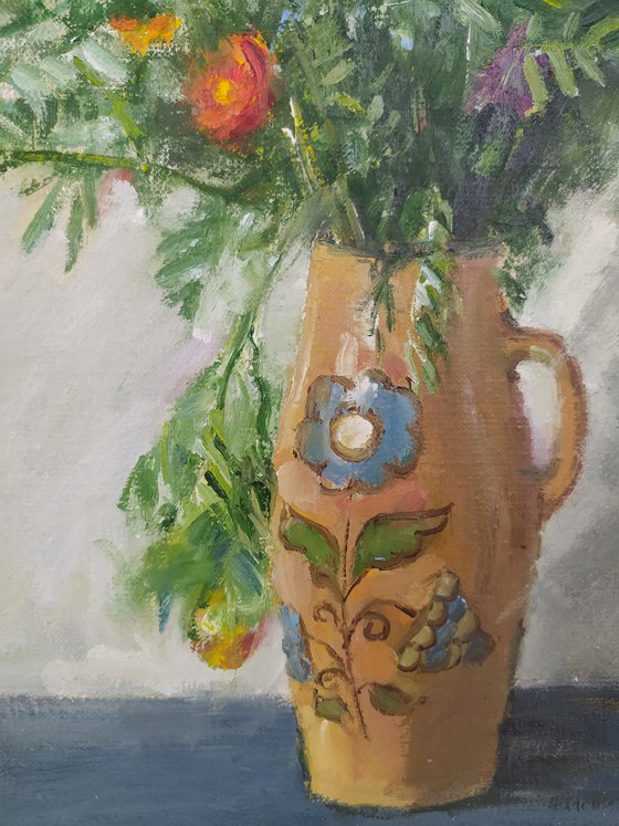 Marigolds in a ceramic pot