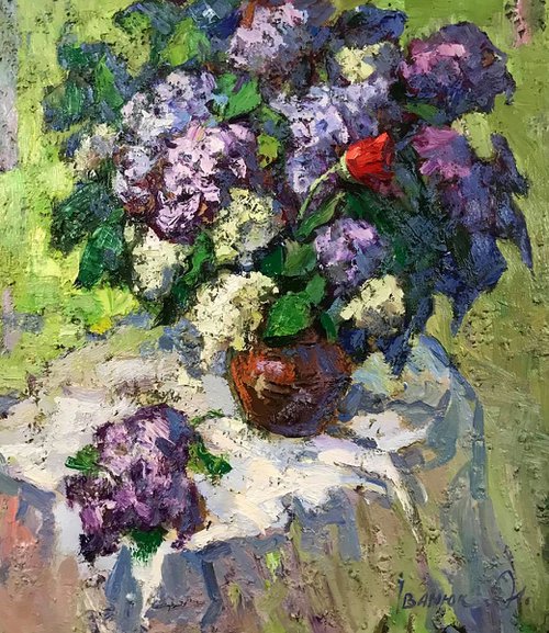 A bouquet of lilacs on the table by Kalenyuk Alex