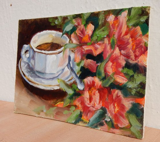 Tea cup with red flowers. Still life.