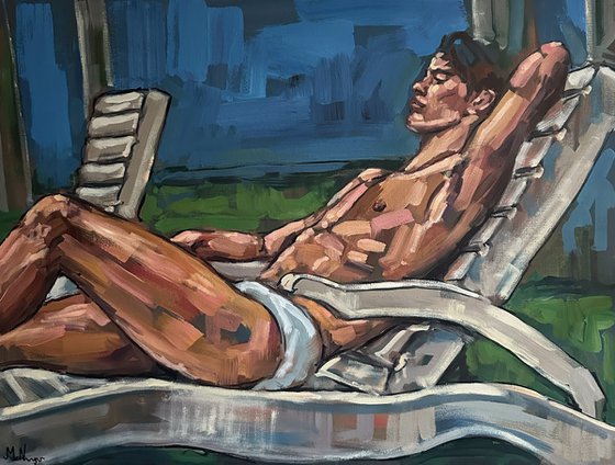Naked man lying on sunbed
