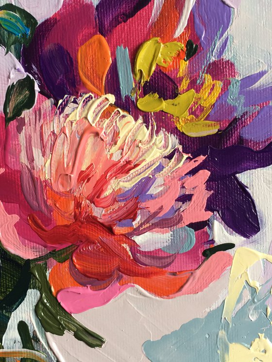 Bright peonies in a glass vase