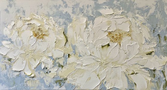 Two cream peonies on blue