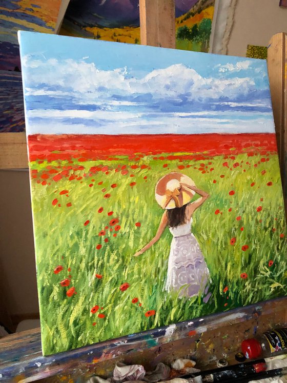 Women in poppy field