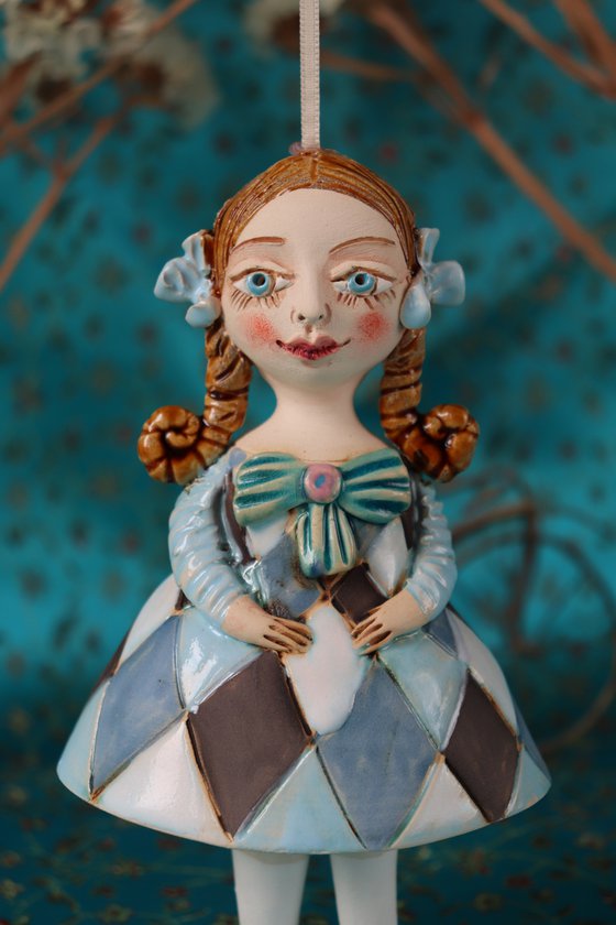 Little Girl in Blue Harlequine Dress. Tiny hanging sculpture