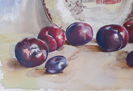 Plums rolled across the table