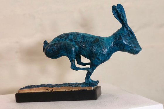 running hare in vivid blue