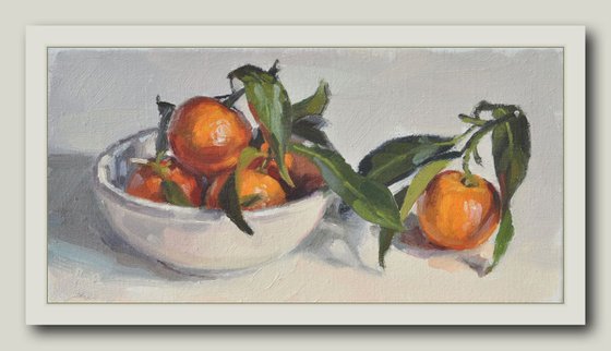 Clementines in a white bowl