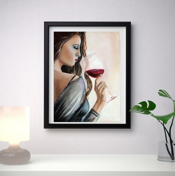 Lady with a Glass of wine. Portrait of a young Woman.
