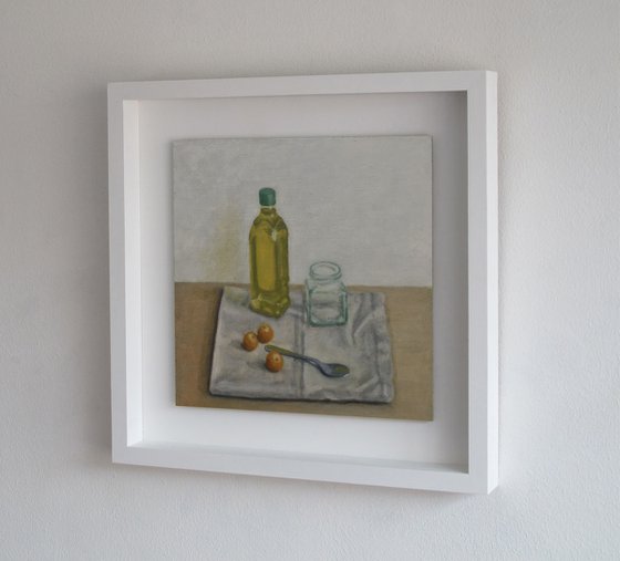 Olive oil bottle with tomatoes