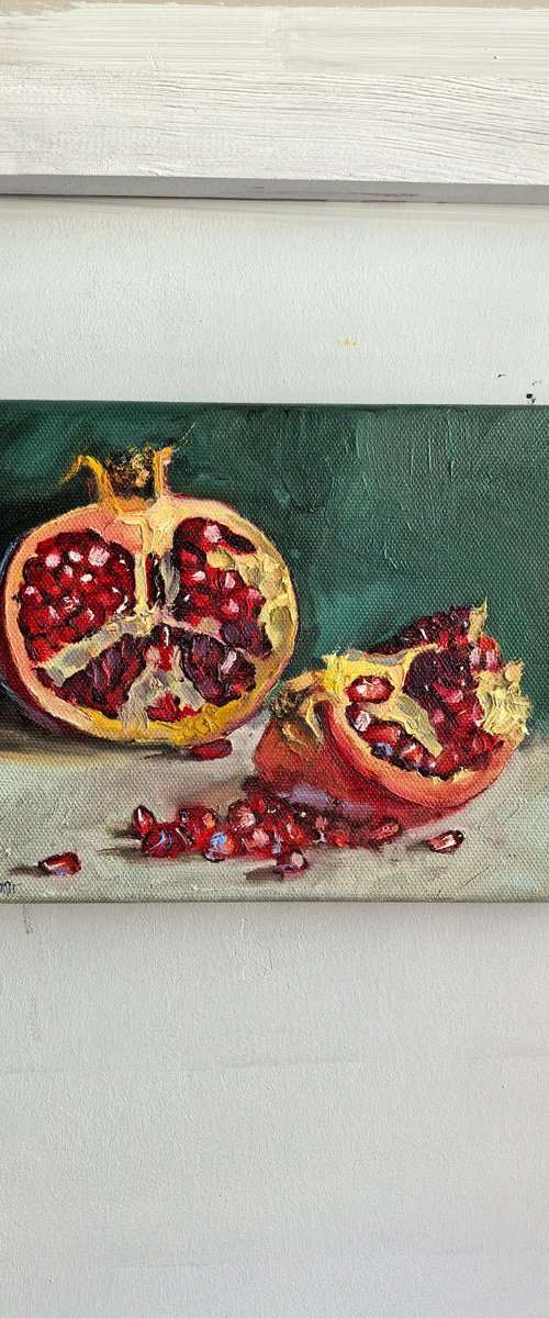 Pomegranate on blue by Leyla Demir