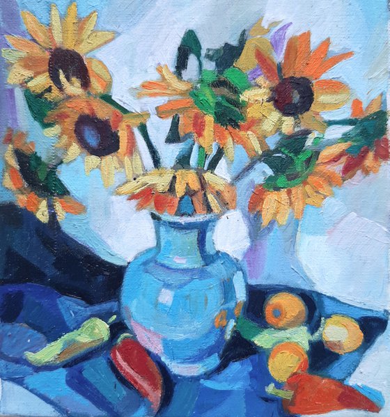 Sunflowers in a  blue vase