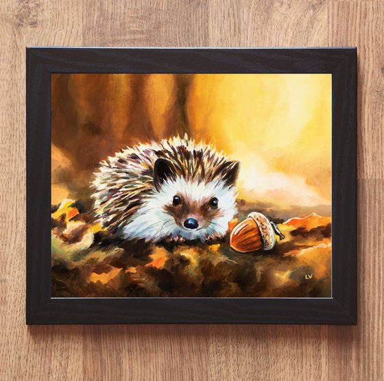 Hedgehog with acorn in fall