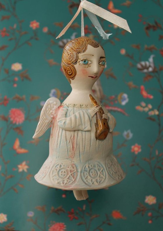 Angel with a flute. Bell-Doll, little ceramic sculpture. Hand made