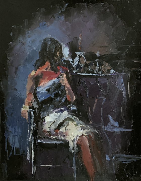 Woman in a cafe on black.