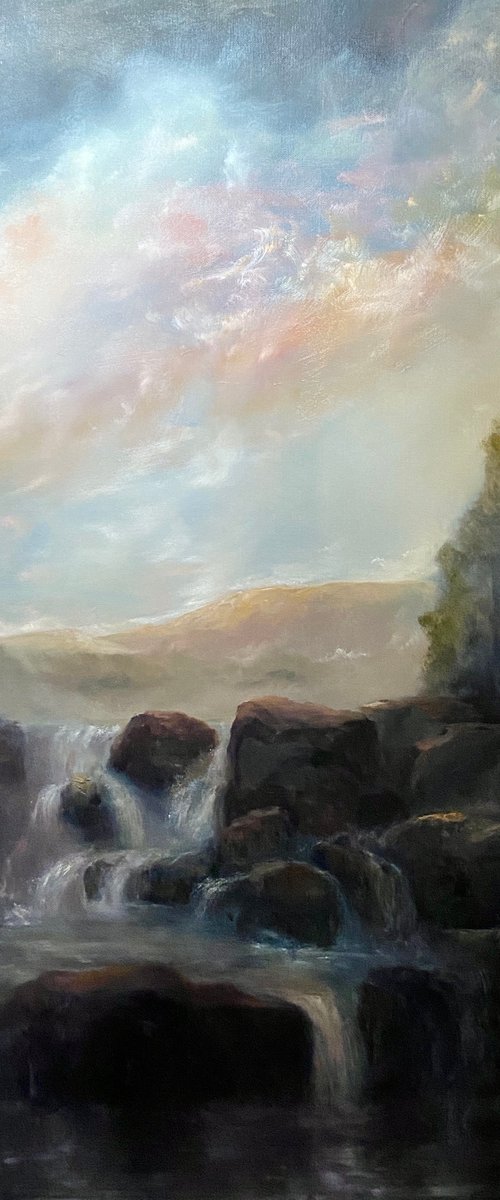 Waterfall under pearlescent sky by Heidi Irene Kainulainen