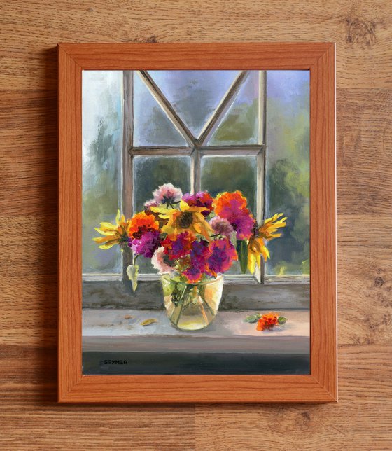 Vase of marigolds on a window