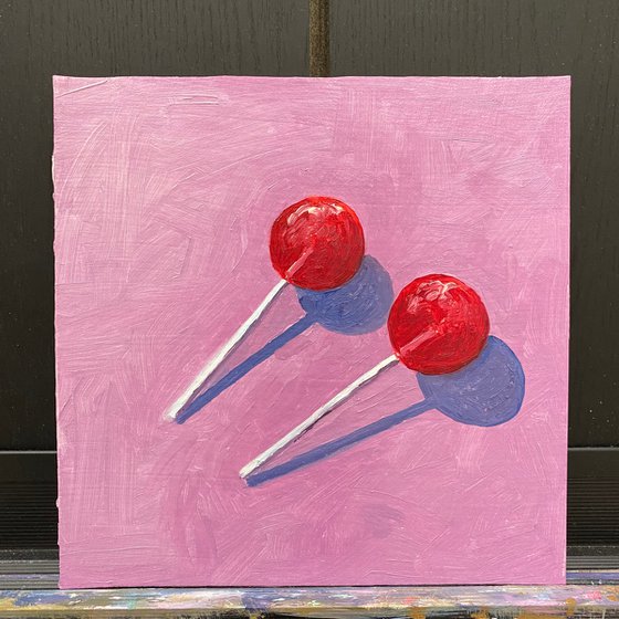 cherry lollipops — modern still life