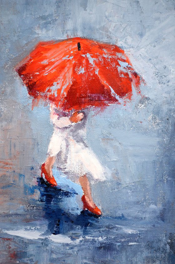 A girl running through puddles