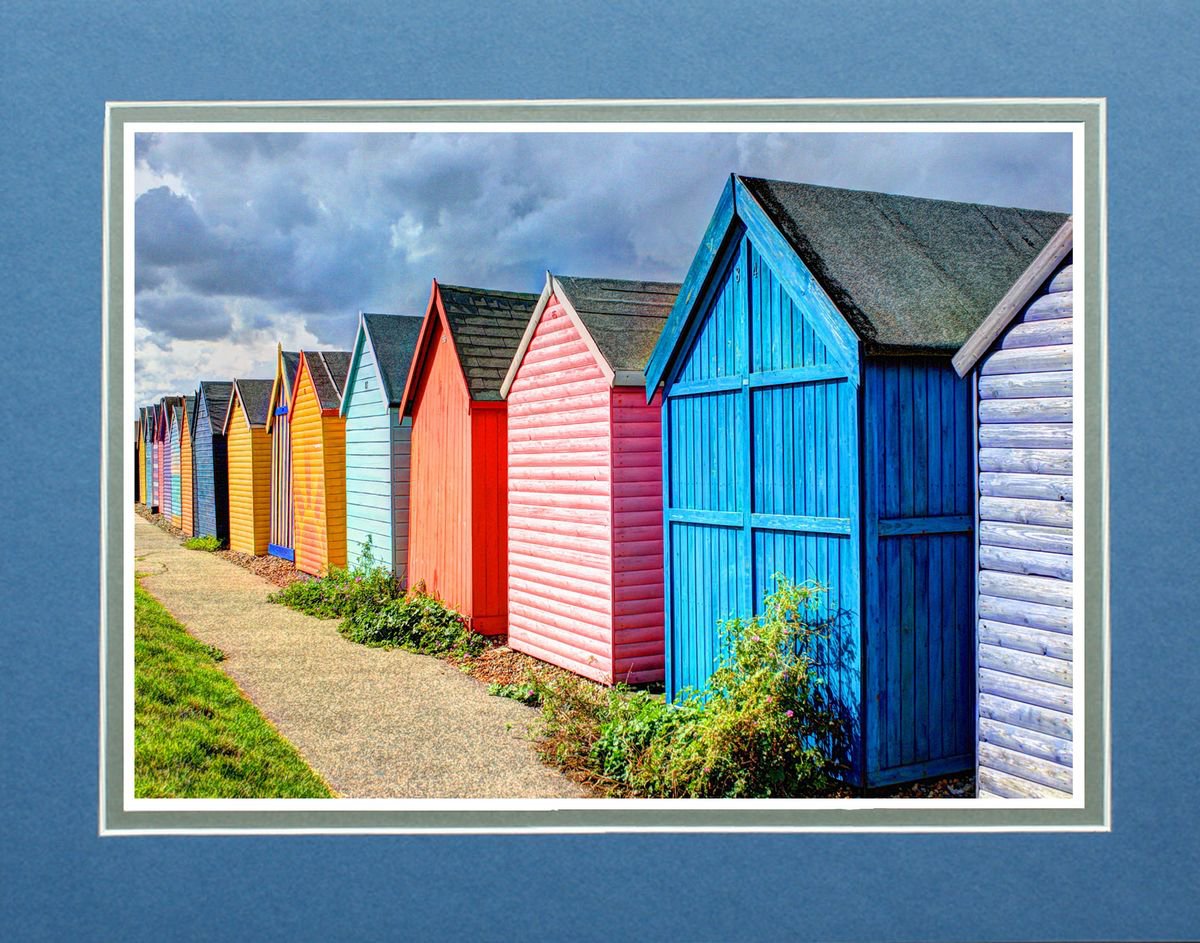 Beach huts in a row by Robin Clarke