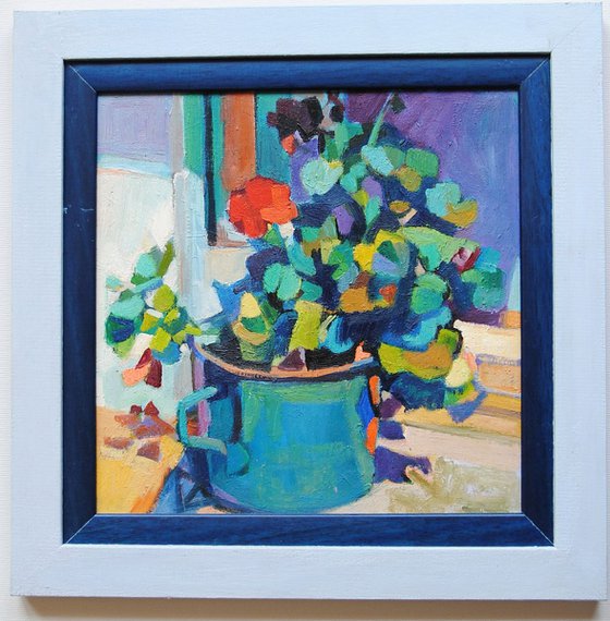 Geraniums in a blue pot