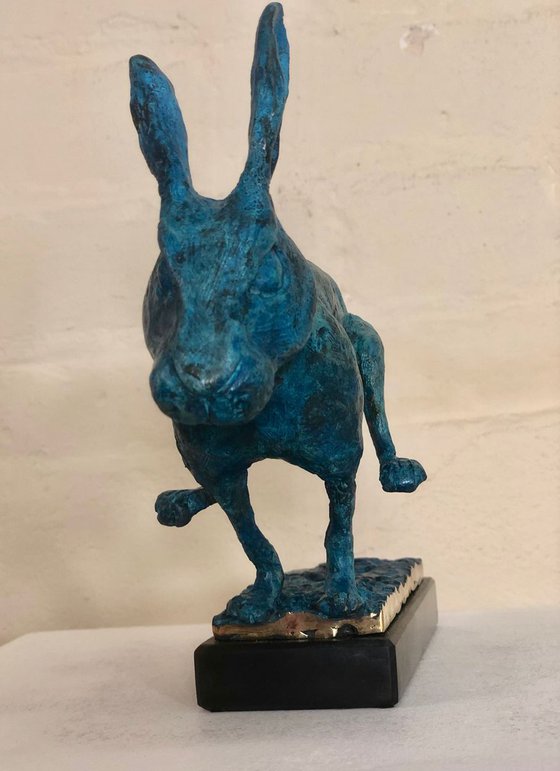 running hare in vivid blue