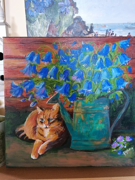 Blue flowers and cat