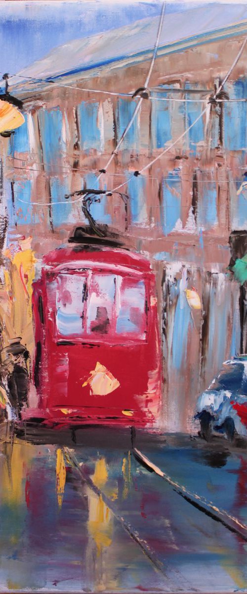 Rainy day in old city with red streetcar by Dmitry Fedorov