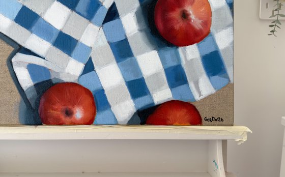 Red apples on a kitchen towel