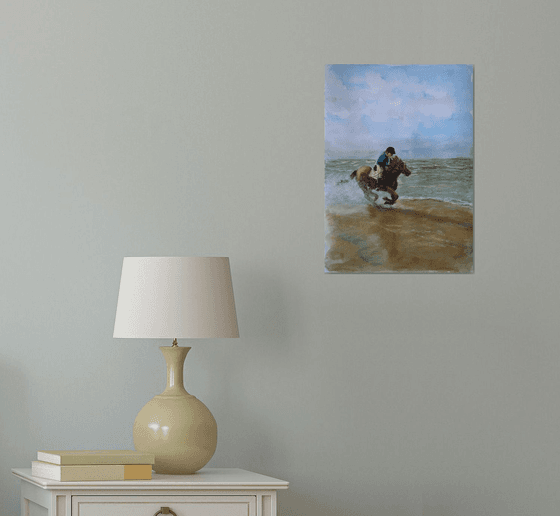 Horse riding along beach