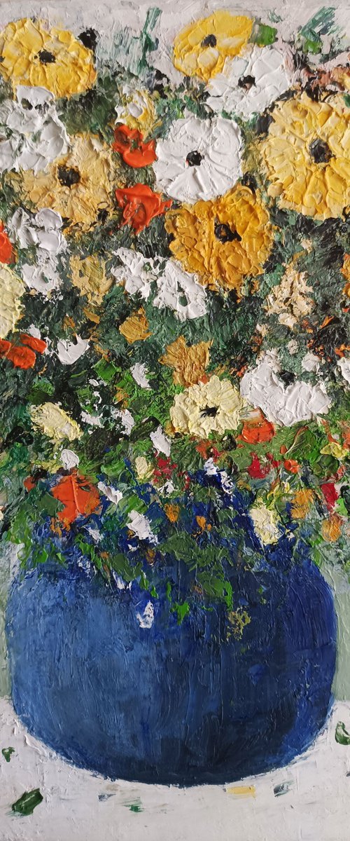 Yellow flowers in a blue vase by Maria Karalyos