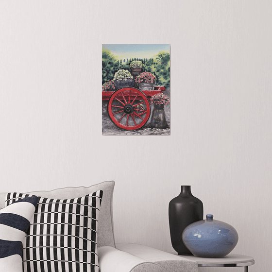 Old red cart with flowers
