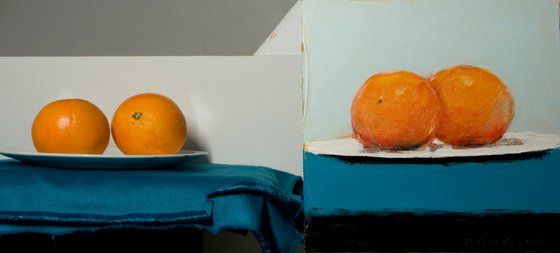 two oranges on blue