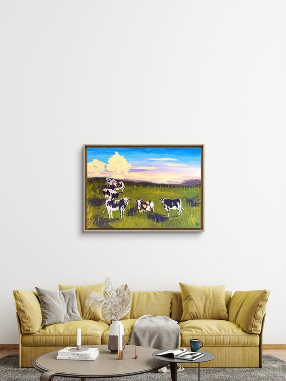 Cows grazing in the field