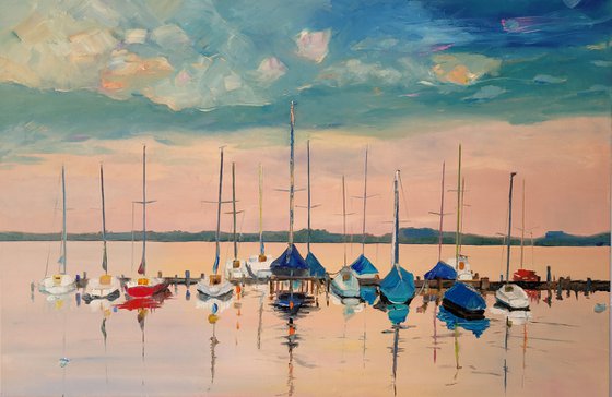 Sailing boats at the jetty. Sunset.