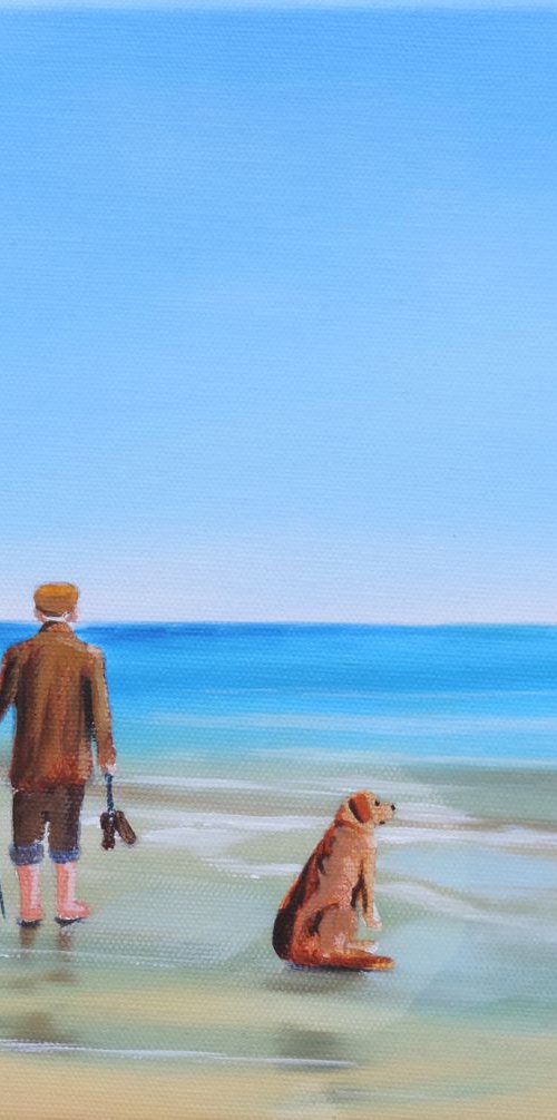 At the beach man and dog by Gordon Bruce
