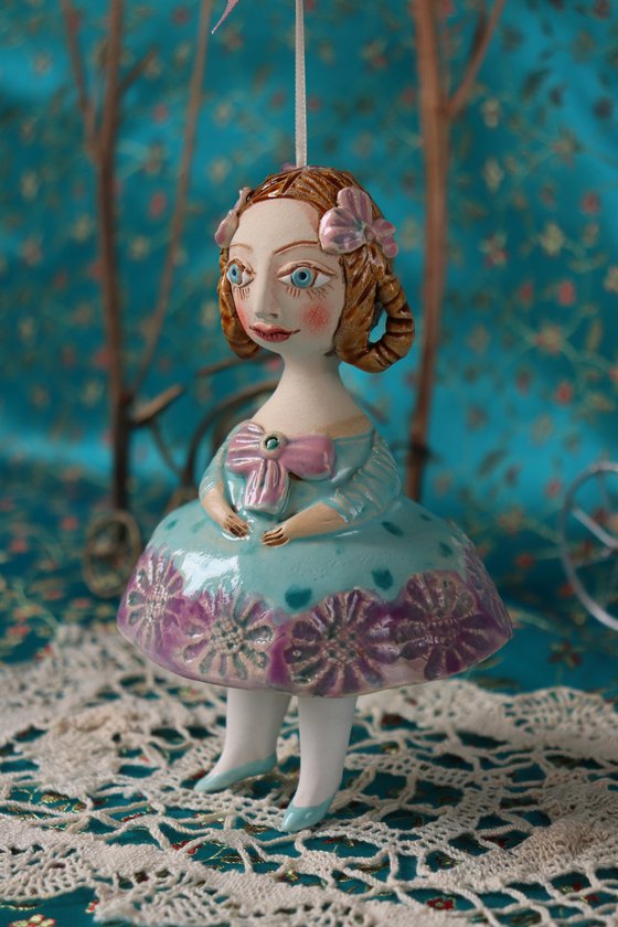 Little Girl in Mint Blue Dress. Tiny hanging sculpture