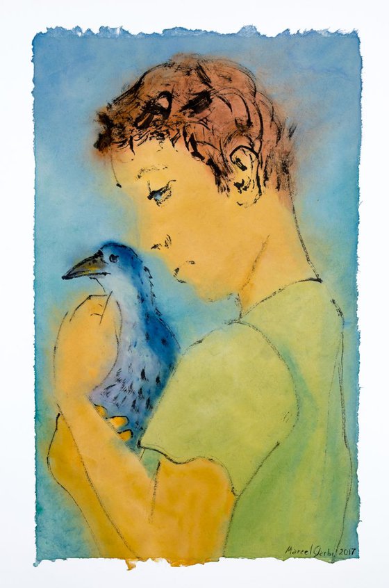 Boy protecting a bird