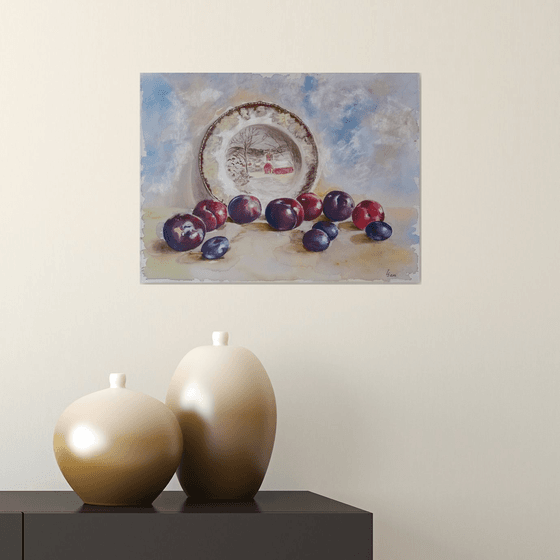 Plums rolled across the table