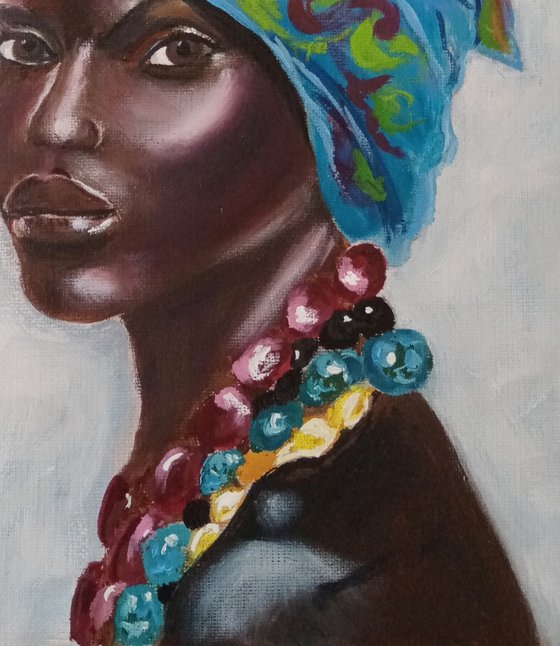 Portrait of a dark-skinned beauty in a turquoise turban