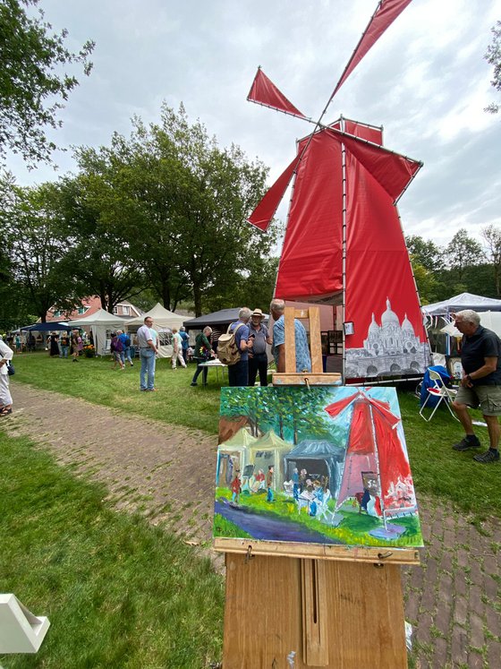 Red windmill at art festival