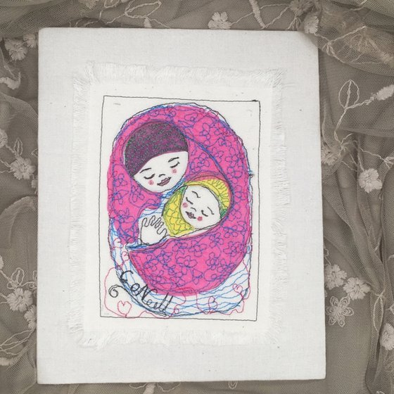 Mother and baby wrapped in a pink blanket.    Mixed media  Textile