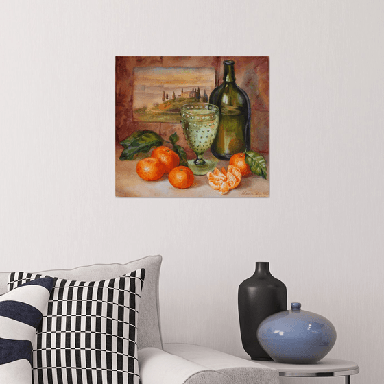 Still life with a green bottle and tangerines