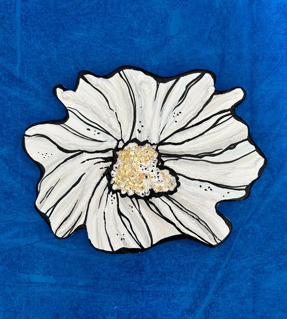 Small white sculptured  flower