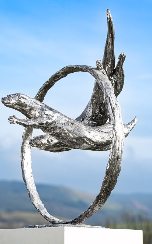 ""Through Clear Water" Otters Swimming Through Ring in Stainless Steel metal by Tanya Russell