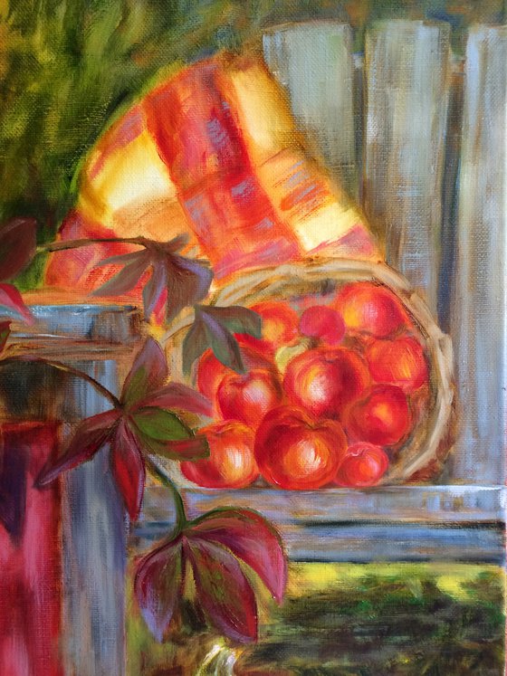 Still life with pink wellingtons, pumpkins and apples in garden